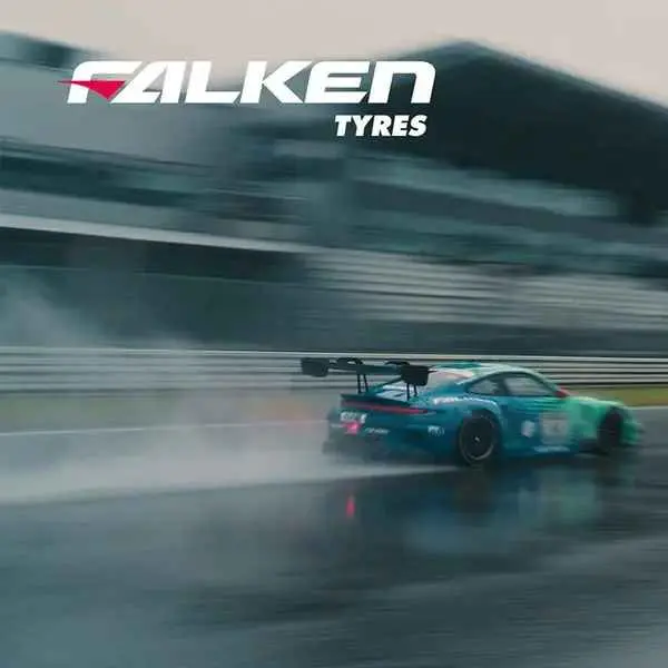 A Falken Tires Porsche GT race car speeding on a wet racetrack, demonstrating its wet traction performance.
