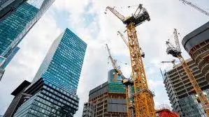 A construction site with large cranes, representing the strength and durability of Hercules tires for heavy-duty jobs.           Show thinking
