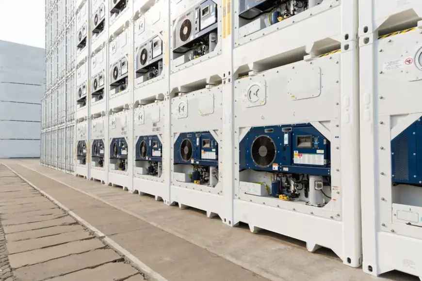 Refrigerated shipping containers at a port, representing the global logistics industry powered by durable Otani commercial tires.